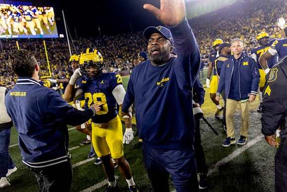 Quinten Johnson (28) and Michigan Team