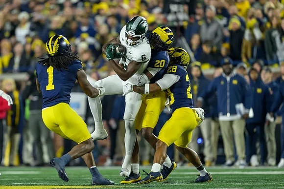 Jaishawn Barham (1), Jyaire Hill (20), and Quinten Johnson (28)