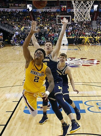 Duncan Robinson (22) and Moritz Wagner (13)