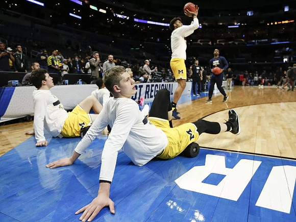C.J. Baird (24), Moritz Wagner (13), and Isaiah Livers (4)