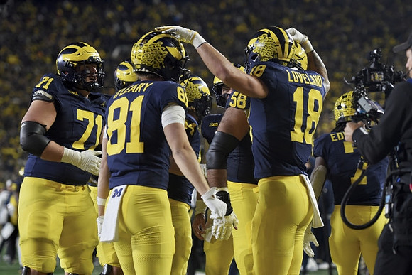 Evan Link (71), Peyton O'Leary (81), Giovanni El-Hadi (58), Colston Loveland (18), and Donovan Edwards (7)