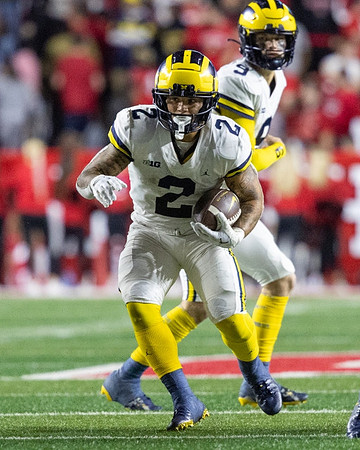Blake Corum (2) and J.J. McCarthy (9)