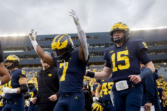 Noah Stewart (61), Donovan Edwards (7), and Alan Bowman (15)