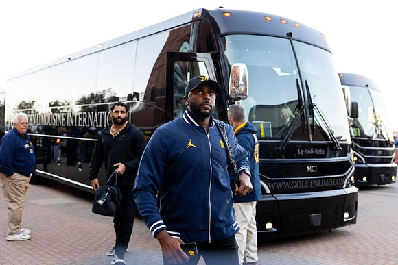 Giovanni El-Hadi (58) and Sherrone Moore