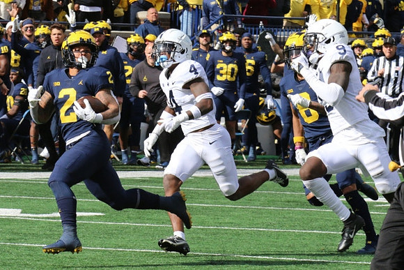 Blake Corum (2) and Ronnie Bell (8)
