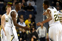 Spike Albrecht (2), Caris LeVert (23), and Zak Irvin (21)