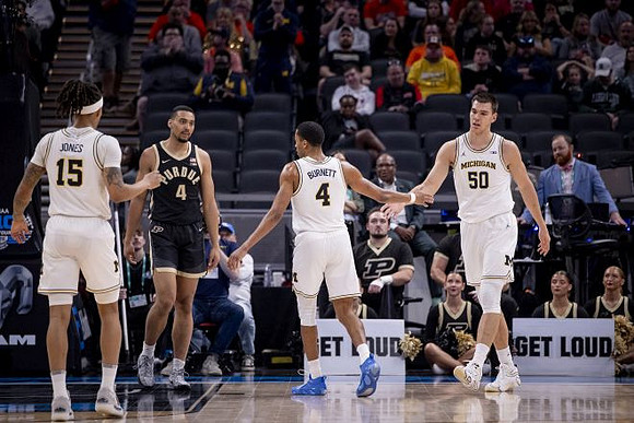 Rubin Jones (15), Nimari Burnett (4), and Vladislav Goldin (50)