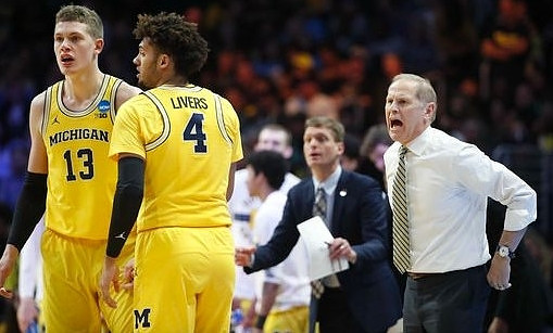 Moritz Wagner (13), Isaiah Livers (4), Luke Yaklich, and John Beilein
