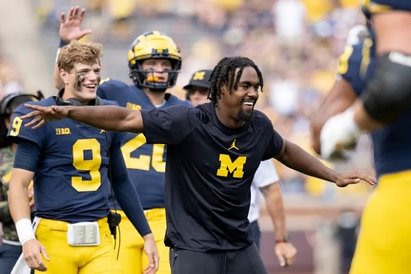 J.J. McCarthy (9) and Donovan Edwards (7)