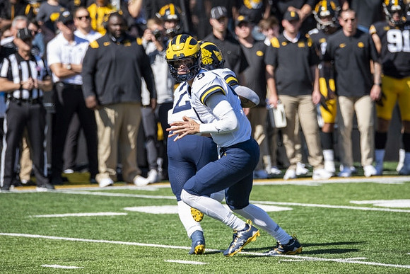 Blake Corum (2) and J.J. McCarthy (9)