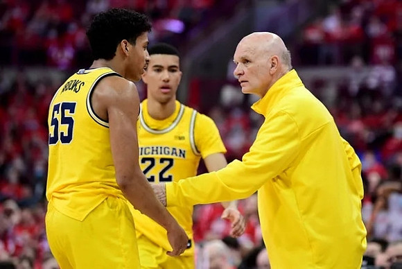 Eli Brooks (55), Caleb Houstan (22), and Phil Martelli