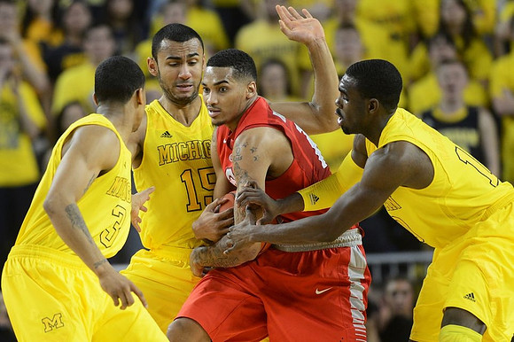 Trey Burke (3), Jon Horford (15), and Tim Hardaway Jr. (10)
