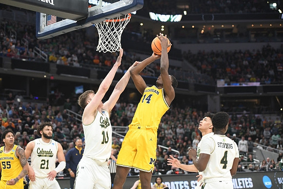 Moussa Diabate (14) and Eli Brooks (55)