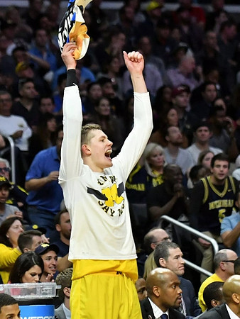 Moritz Wagner (13) and Deandre Haynes