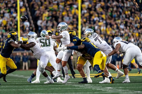 Mason Graham (55), Derrick Moore (8), and Josaiah Stewart (0)