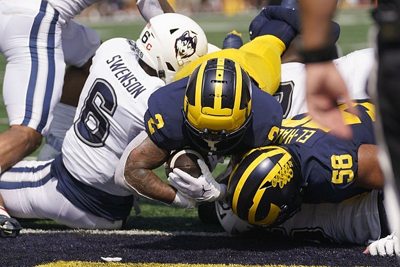 Blake Corum (2) and Giovanni El-Hadi (58)