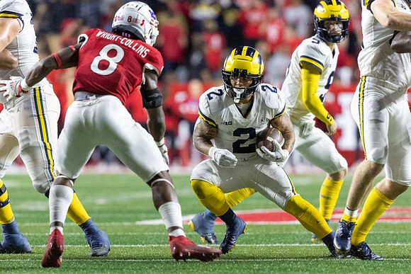 Blake Corum (2) and J.J. McCarthy (9)