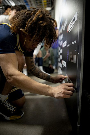 Tre Donaldson (3) and Michigan Team