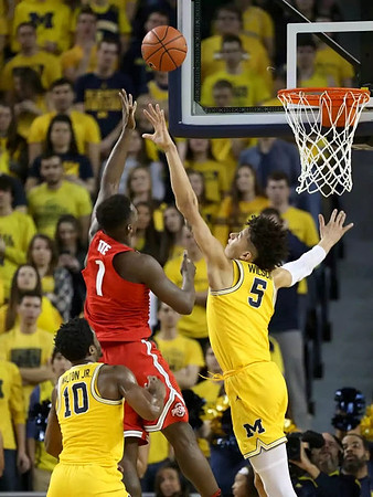 Derrick Walton Jr. (10) and D.J. Wilson (5)
