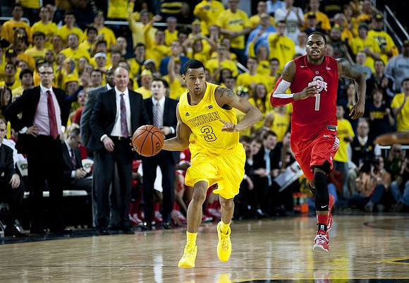 Trey Burke (3) and Ohio State Head Coach Thad Matta