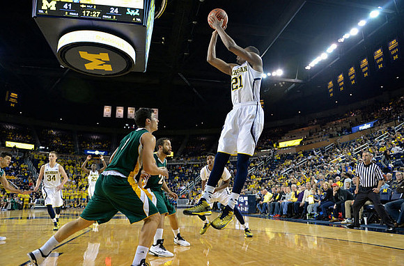 Mark Donnal (34), Caris LeVert (23), and Zak Irvin (21)