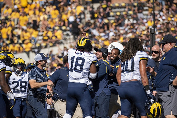 Quinten Johnson (28), Eyabi Anoma Okie (18), and Mike Morris (90)