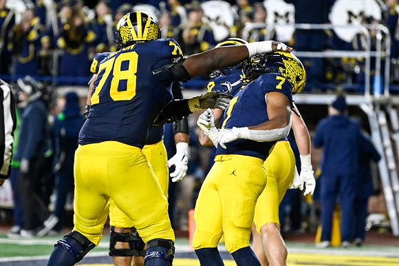 Myles Hinton (78) and Donovan Edwards (7)