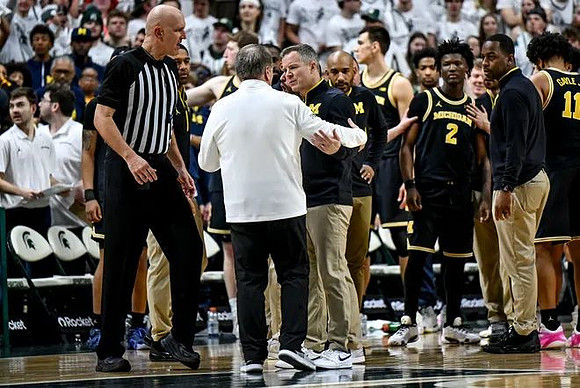 Michigan State Head Coach Tom Izzo, Dusty May, and Michigan Team