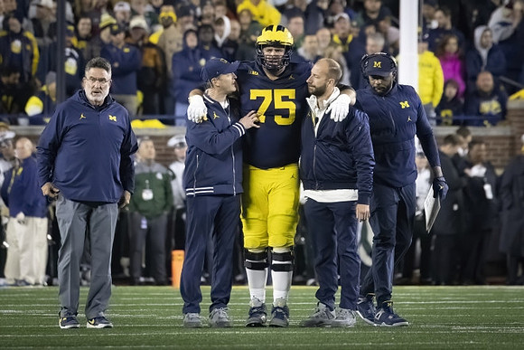 Andrew Gentry (75) and Sherrone Moore