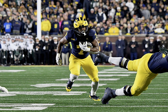 Donovan Edwards (7) and Myles Hinton (78)
