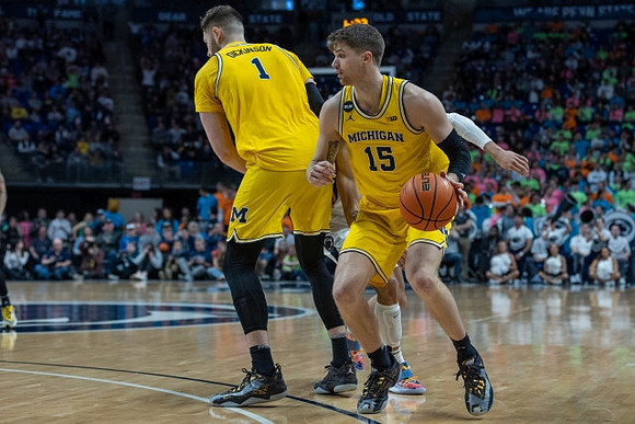 Hunter Dickinson (1) and Joey Baker (15)