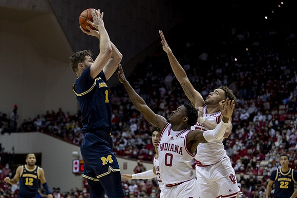 DeVante' Jones (12) and Hunter Dickinson (1)