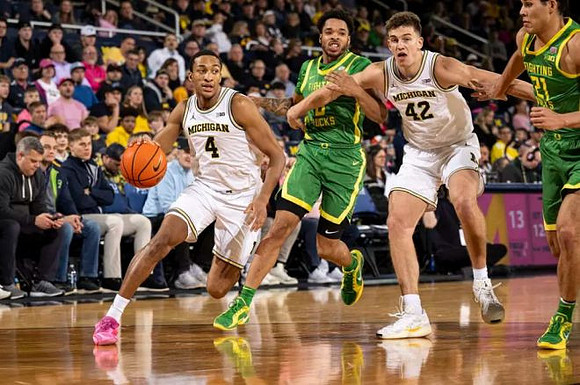 Nimari Burnett (4) and Will Tschetter (42)