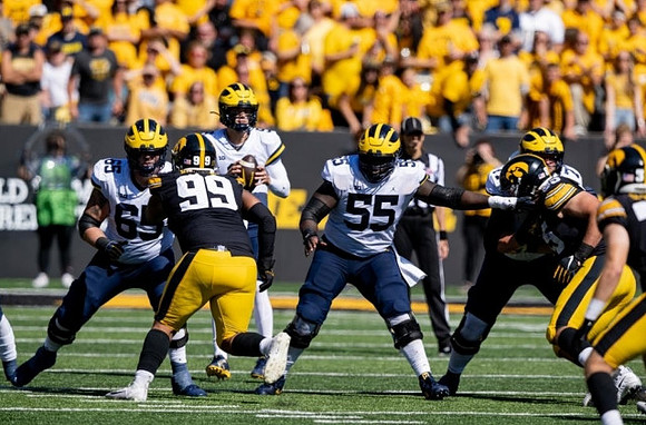 Zak Zinter (65), Olusegun Oluwatimi (55), J.J. McCarthy (9), and Trevor Keegan (77)