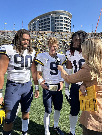 Mike Morris (90), J.J. McCarthy (9), and Eyabi Anoma Okie (18)