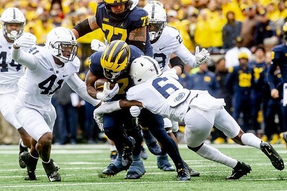 Donovan Edwards (7) and Trevor Keegan (77)