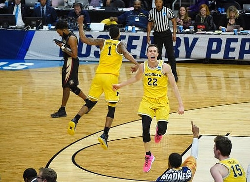 Charles Matthews (1), Duncan Robinson (22), and Jon Teske (15)