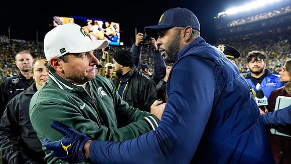 Michigan State Head Coach Jonathan Smith and Sherrone Moore