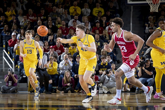 Joey Baker (15), Will Tschetter (42), and Tarris Reed Jr. (32)