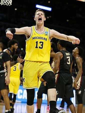 Moritz Wagner (13) and Zavier Simpson (3)