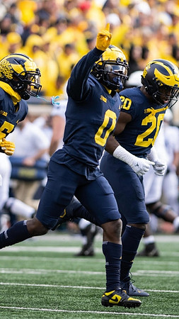 DJ Turner (5), Mike Sainristil (0), and Kalel Mullings (20)