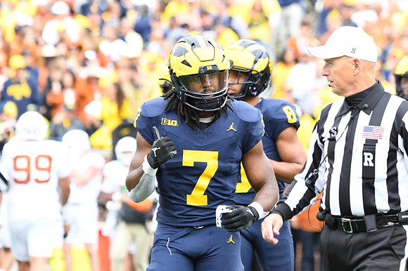 Donovan Edwards (7) and Tyler Morris (8)