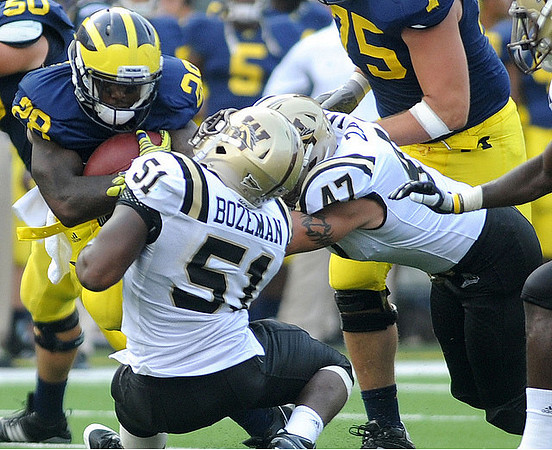 David Molk (50), Fitzgerald Toussaint (28), and Michael Schofield (75)
