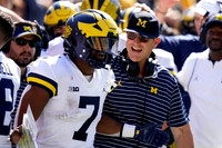 Donovan Edwards (7) and Jim Harbaugh