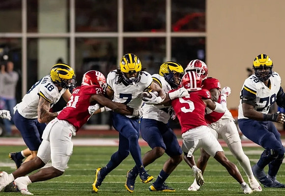 Colston Loveland (18), Donovan Edwards (7), and Myles Hinton (78)