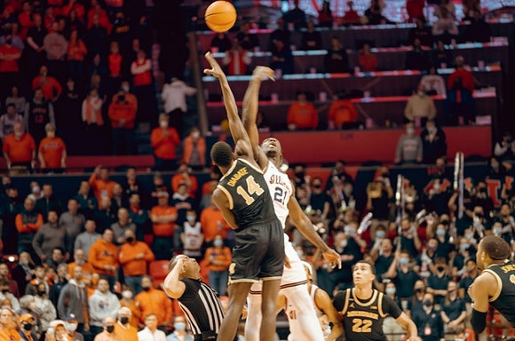 Moussa Diabate (14), Caleb Houstan (22), and DeVante' Jones (12)