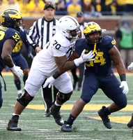 Jaylen Harrell (32) and Kris Jenkins (94)