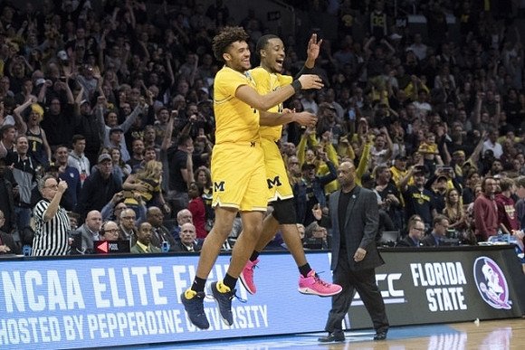Isaiah Livers (4) and Muhammad-Ali Abdur-Rahkman (12)