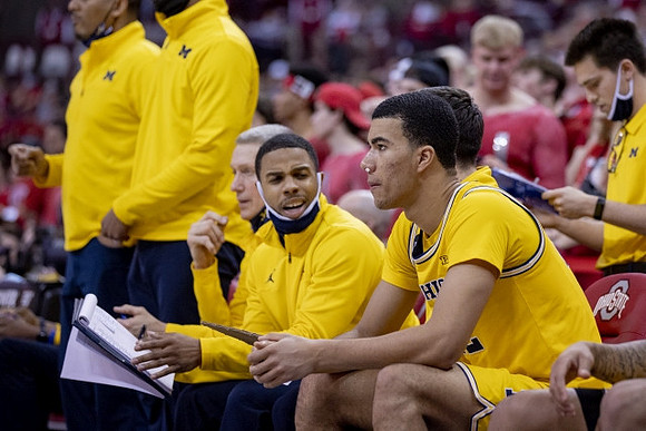 Caleb Houstan (22) and Michigan Team