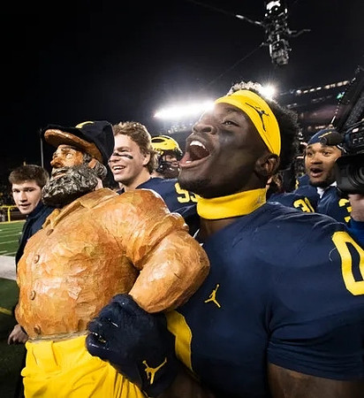 Paul Bunyan Trophy and Mike Sainristil (0)